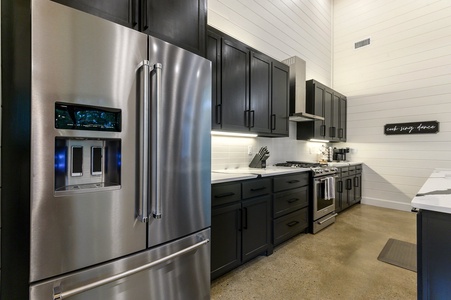 Kitchen features gas stove, oven, dishwasher, microwave, and more