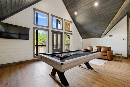 Upstairs game room with pool table