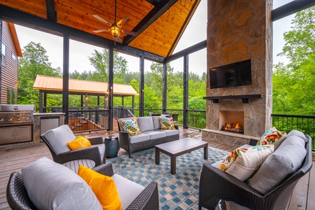 Peaceful outdoor seating area with gas fireplace and Smart TV