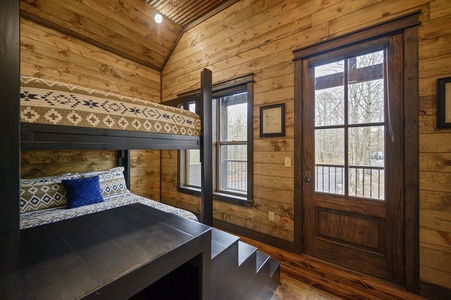 Upstairs bunk room has 4 queen beds sleeping 8 guests