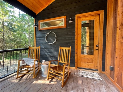 Enjoy peaceful front porch sittin' in the rocking chairs