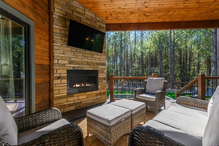 Seasonal outdoor fireplace and streaming TV on the back deck