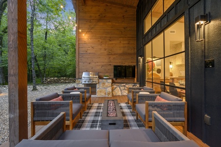 Outdoor kitchen, TV, and gas firepit table