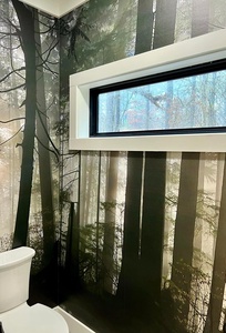 Get lost in the forest in this fun bathroom