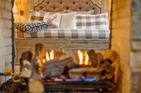 Romantic peek thru fireplace from living room to bedroom