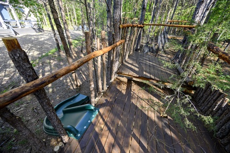 Treehouse includes a slide, giant net hammock, climbing net wall, swings, and a zip line!