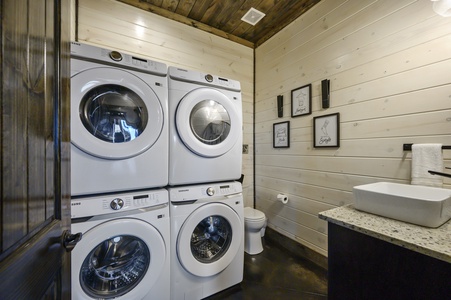 Laundry closet with double washers and dryers and half bath