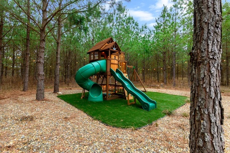 Kids will love this outdoor playset with slides, swings, rock wall, and more!
