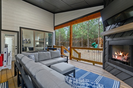 Large outdoor entertaining space with view of the playset