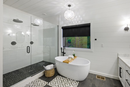 Spacious master bathroom with double vanity, soaking tub, and oversized walk-in shower