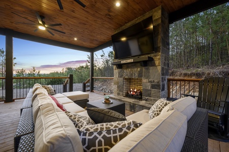 Covered back deck features a gas fireplace and Smart HDTV