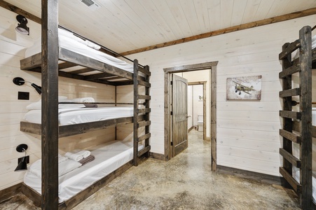 Downstairs bunk room sleeps 18 guests in twin-sized beds