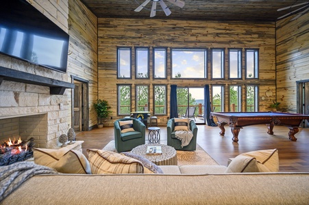 Floor-to-ceiling windows provide plentiful light to the game room