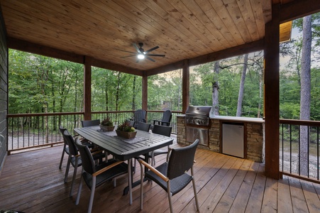 Outdoor dining area with built-in grilling station
