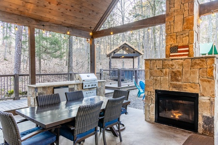 Outdoor dining table, gas fireplace, and gas grilling station