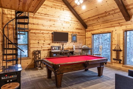 Game room with pool table, arcade, and plenty of seating