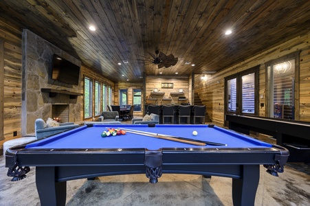 Spacious game room with pool, shuffleboard, arcade, and card table