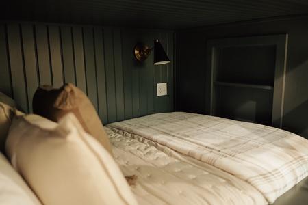Bunks have shelf cubby and light