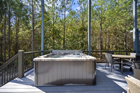 Enjoy a relaxing soak in the hot tub amongst the trees