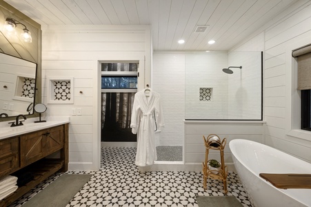 Spacious master bathroom with soaking tub and rainfall shower