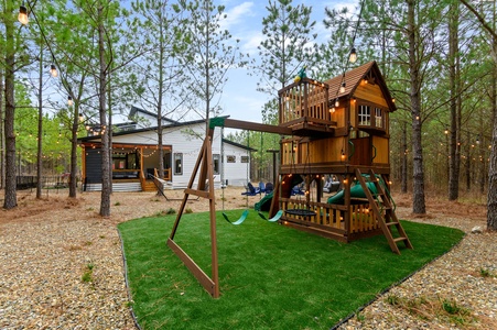 Kids will love this outdoor playset with slides, swings, rock wall, and more!