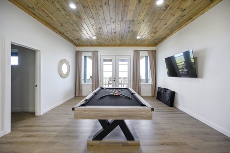 Game room with pool table and Smart TV