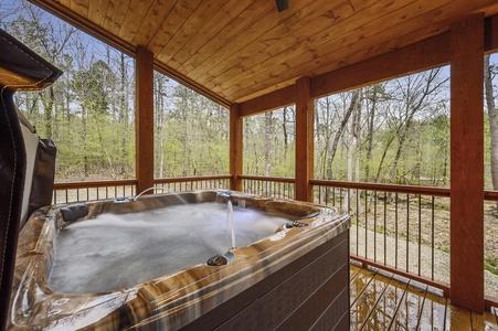Hot tub with view of forest and creek