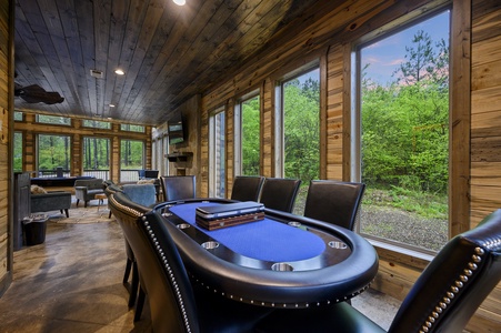 Spacious game room with pool, shuffleboard, arcade, and card table