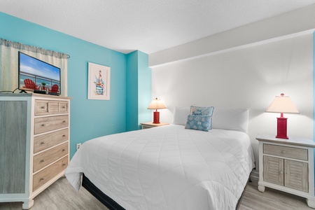 Drift off in your coastal-inspired bedroom with cheerful turquoise walls, crisp linens, and beachy touches that bring seaside serenity indoors.