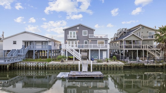 5 Bedrooms with multiple balconies, dock, and only 2 blocks from the beach.
