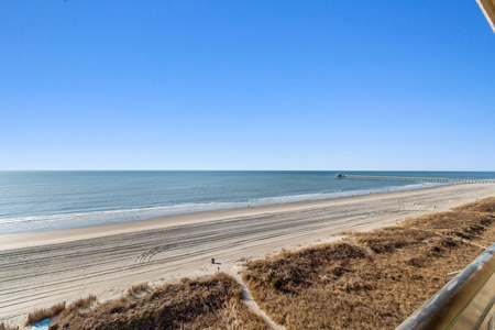 Stunning oceanfront view showcasing miles of pristine coastline and peaceful waters stretching to the horizon.