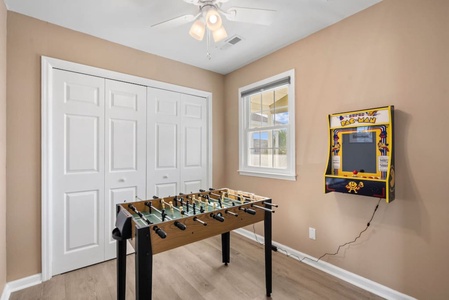 Game room with foosball and pac man machine