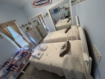 Third bedroom with 3 single beds.