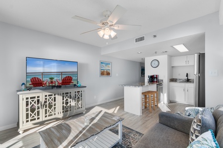 Unwind in your bright, airy living space where coastal charm meets modern comfort. Natural light streams across the open layout.