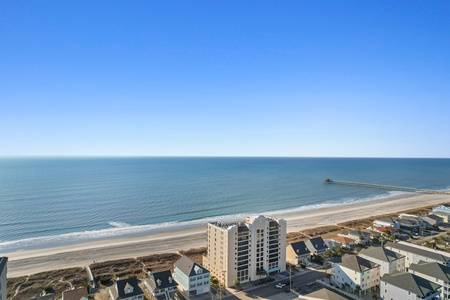 Stunning beachfront location with pristine sandy shores and endless ocean views stretching to the horizon.