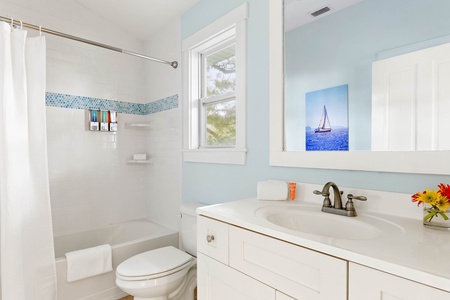 Bathroom 3 features a tub and shower combo.
