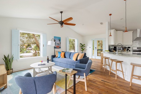 The open-concept living room and dining room feature a layout ready-made for meals, movies, and game-watching.