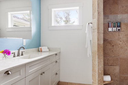 Bathroom 1 features a walk-in shower. Like all our bathrooms, it comes with an abundance of provided toiletries and personal hygiene items.