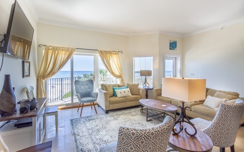 Living area with gulf views and seating for eight