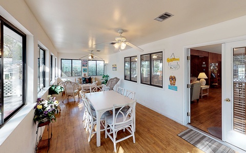 First floor sun room with seating for ten