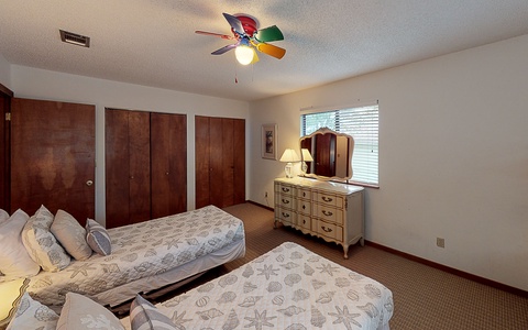Second floor guest room with twin beds and twin bunk
