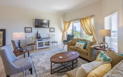 Living area with gulf views and flat screen TV