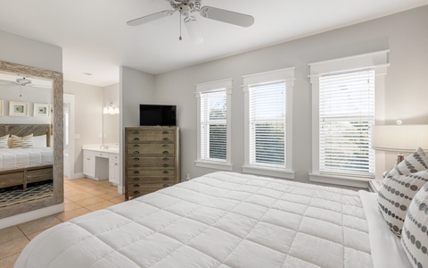 King-Sized Primary Bedroom Featuring a Smart TV