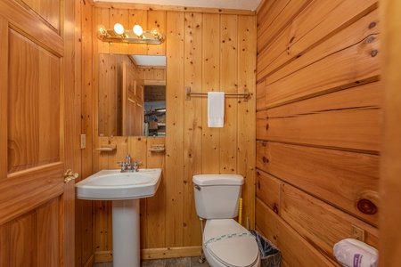 Half bath at Wildlife Retreat, a 3 bedroom cabin rental located in Pigeon Forge