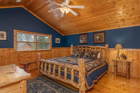 Bed, dresser, and night table at Almost Bearadise, a 4 bedroom cabin rental located in Pigeon Forge