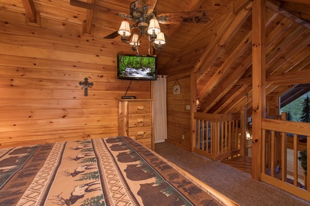 storage and television in the loft bedroom at always & forever a 1 bedroom cabin rental located in pigeon forge