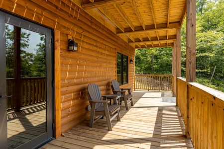 Seating on lower deck at J's Hideaway, a 4 bedroom cabin rental located in Pigeon Forge