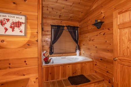 Jacuzzi tub in the upper bedroom at Hibernation Station, a 3-bedroom cabin rental located in Pigeon Forge
