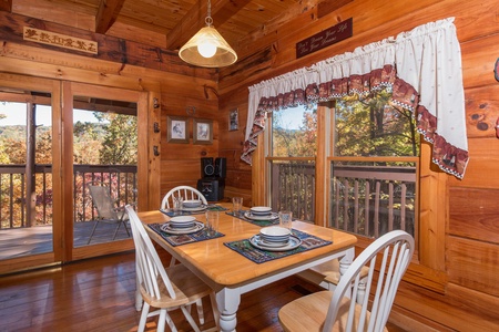 Dining table for four at Hawk's Nest, a 1 bedroom cabin rental located in Pigeon Forge