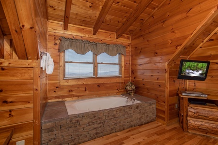 Jacuzzi tub in the loft bedroom at 5 Star View, a 3 bedroom cabin rental located in Gatlinburg